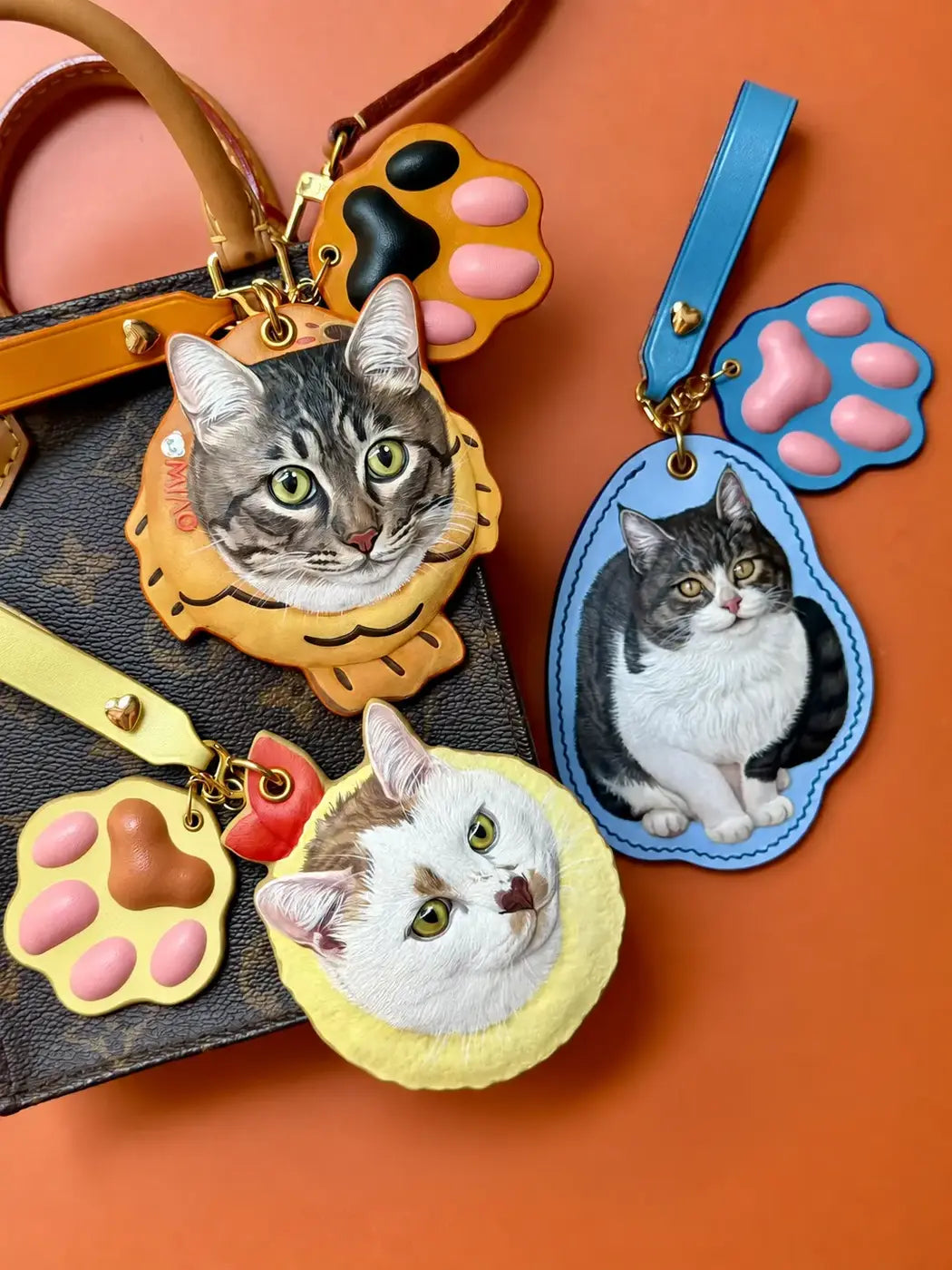 A collection of finished hand-carved leather cat portraits