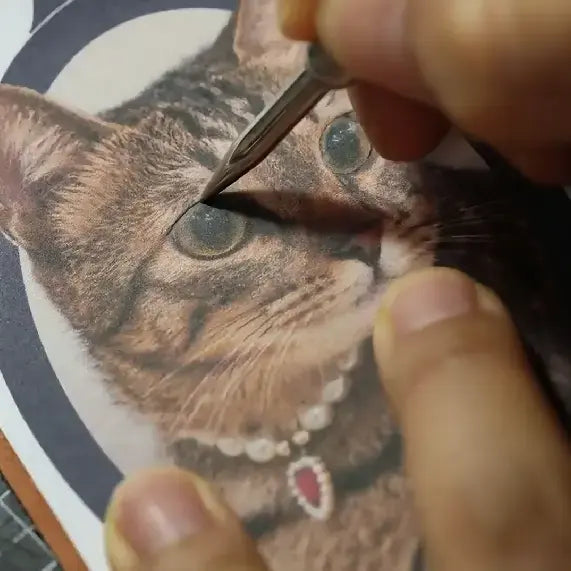 Transferring a pet portrait outline onto leather by hand