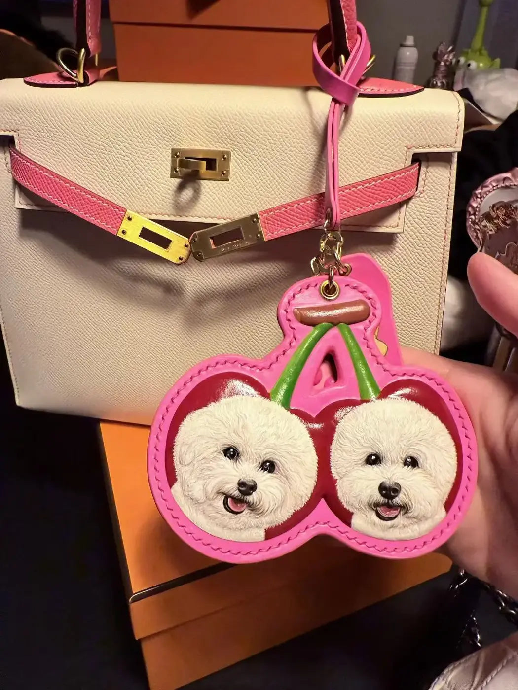 Custom leather pet portrait attached to a handbag as a decorative accessory