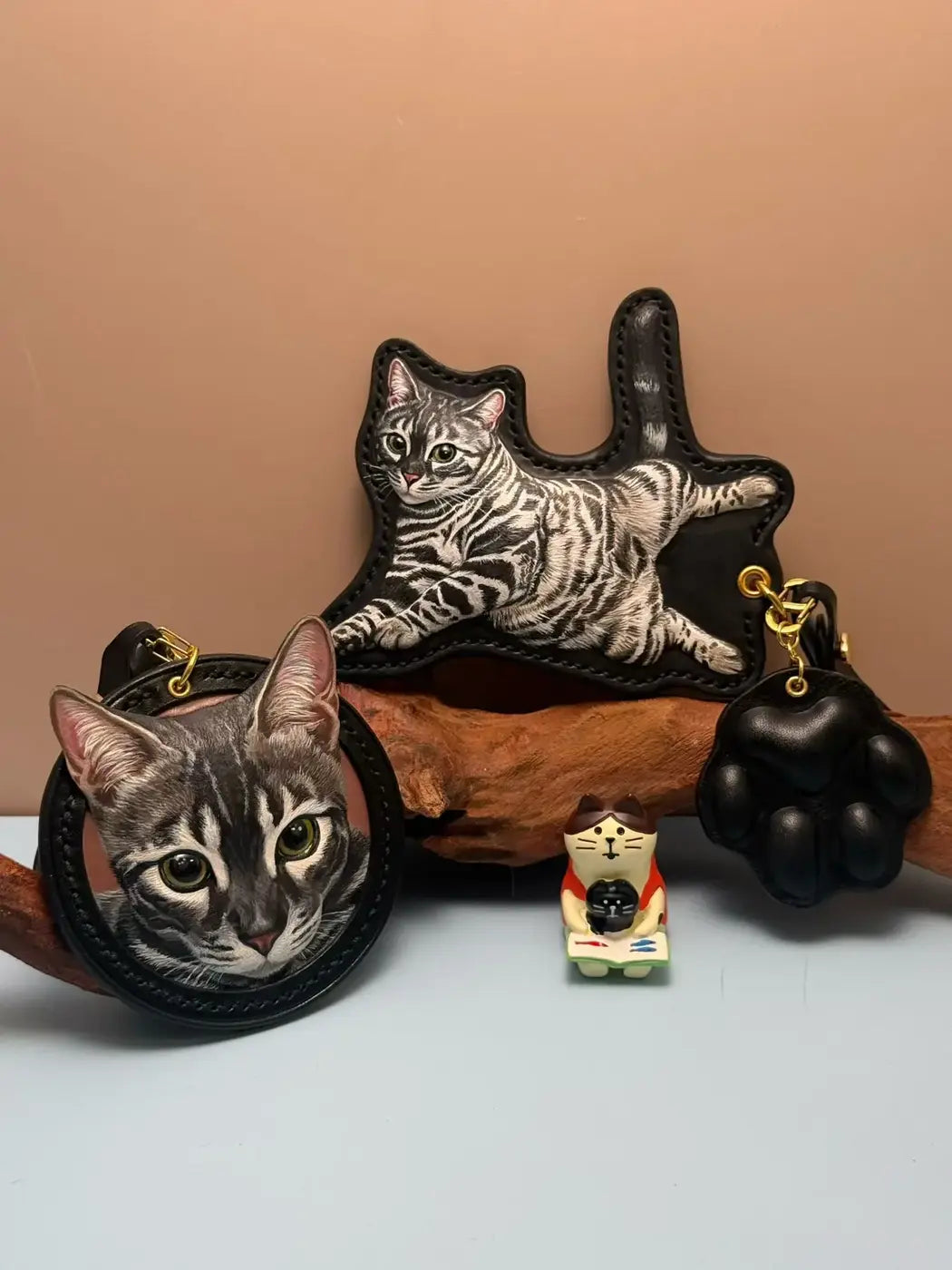 A collection of black leather cat portraits