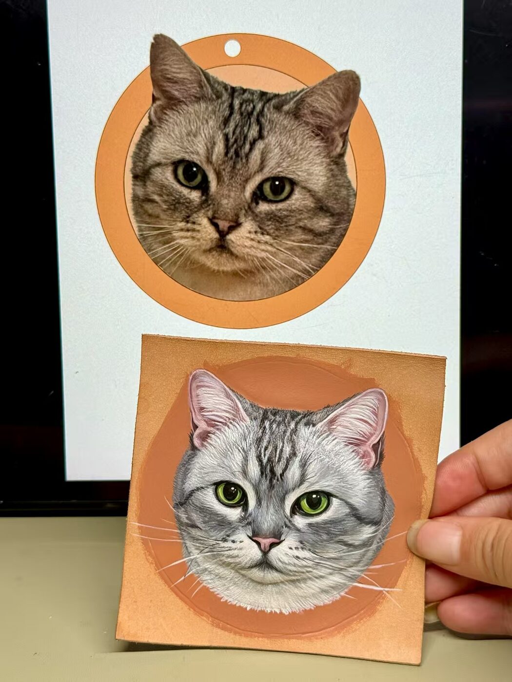 Silver tabby reference photo beside its hand-painted leather portrait